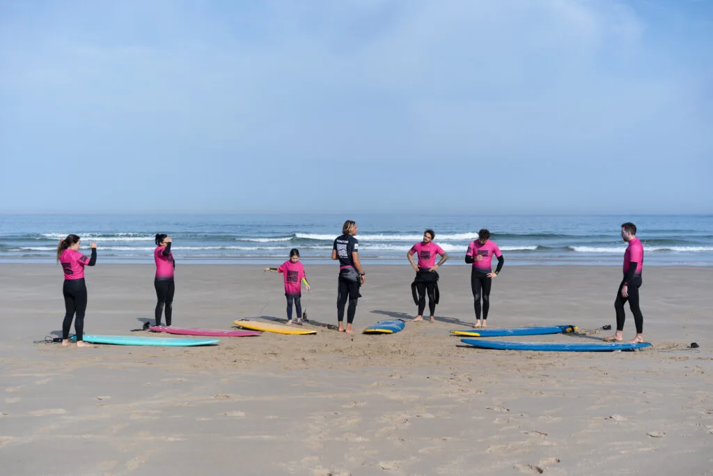 Our instructor giving the theorical instructions to hois students while doing a Surf Lesson in Pantin