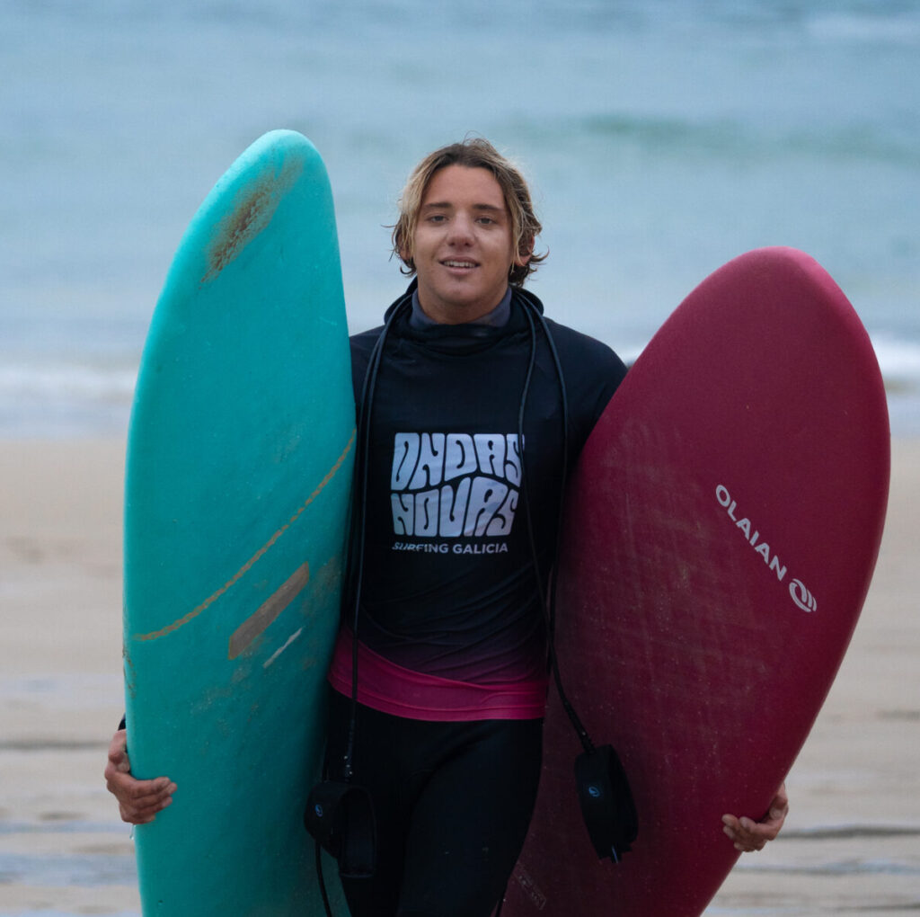 Juul, our surf instructor, carrying some boards